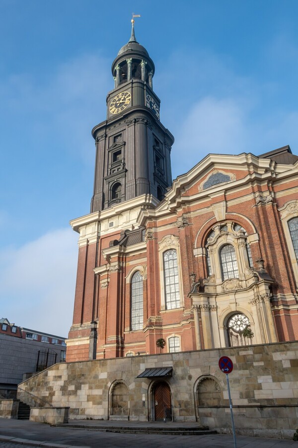 Baroque church clock tower, among historic Hamburg landmarks and monuments.
