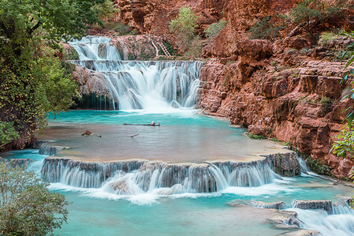 Beaver Falls in Havasupai near Grand Canyon, Arizona: turquoise travertine pools and red canyon cascades.