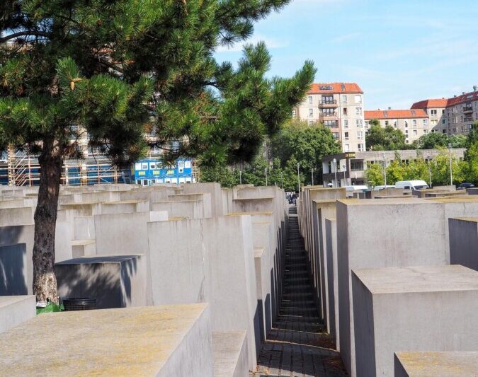 Holocaust Memorial in Berlin, rows of concrete slabs casting shadows