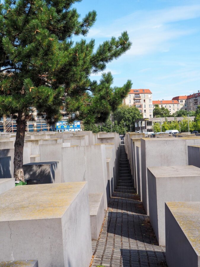 Holocaust Memorial in Berlin, rows of concrete slabs casting shadows
