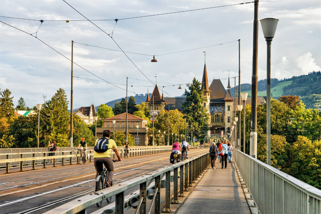 Cyclists in Kirchenfeld bridge, Bern, Switzerland