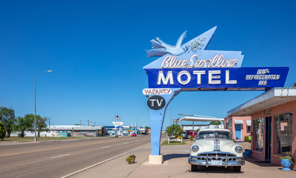 Huge sign and exterior of Blue Swallow Motel in Tucumcari, New Mexico