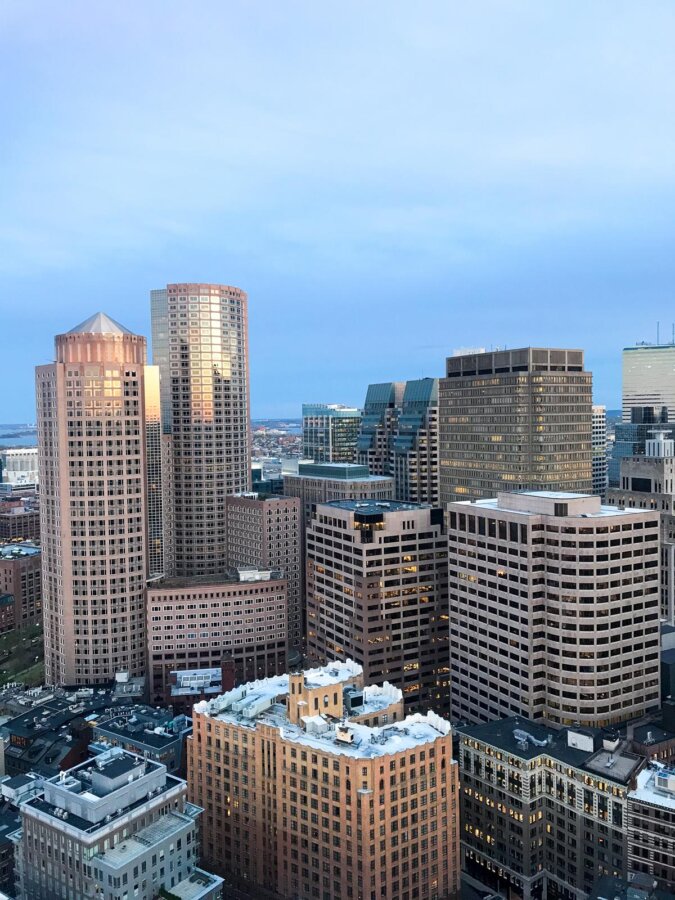 Boston skyline at dusk with sunset hues