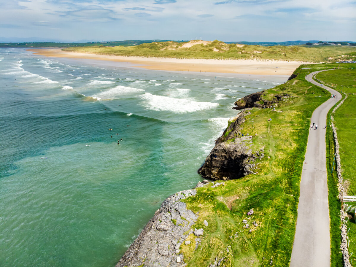 Aerial view of Tullan Strand and surfers in Bundoran, Ireland