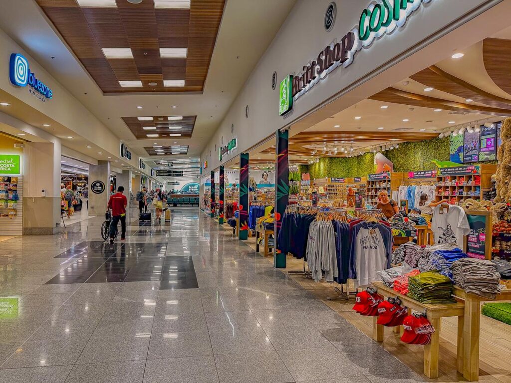 Passengers and shops inside Liberia International Airport in Costa Rica
