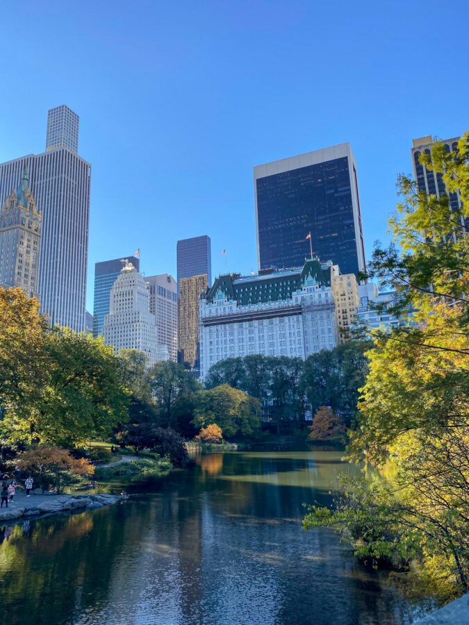 Autumn in Central Park NYC with skyline and fall foliage reflections
