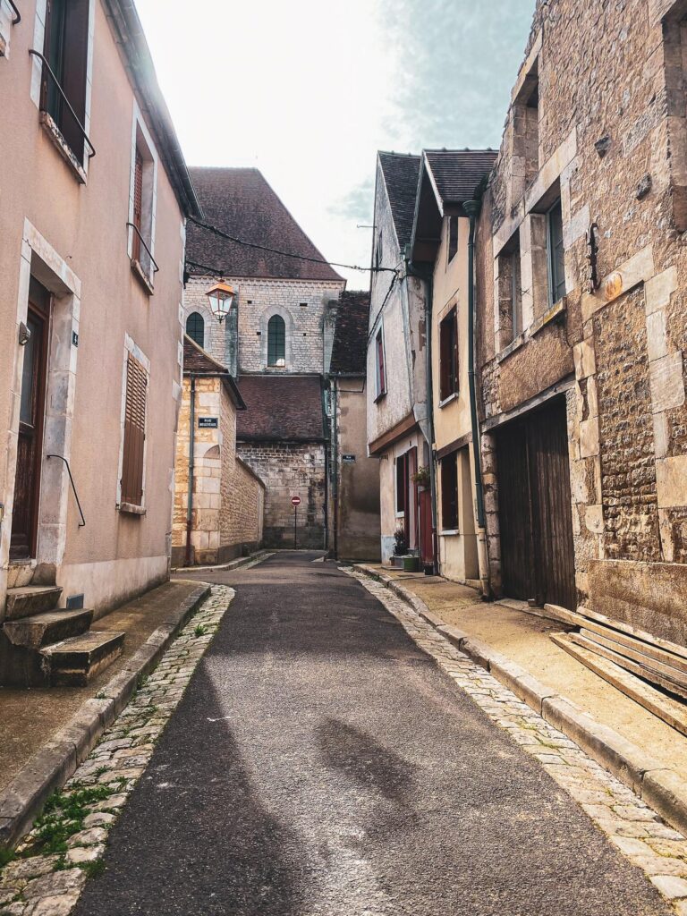 Cobblestone lane lined with stone houses in central Chablis