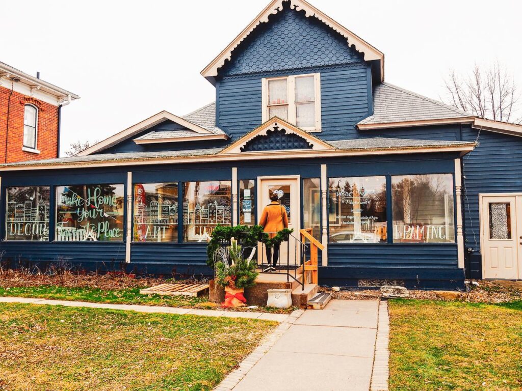 Charming blue vintage gallery storefront showcasing local arts and crafts in Lindström, Minnesota.