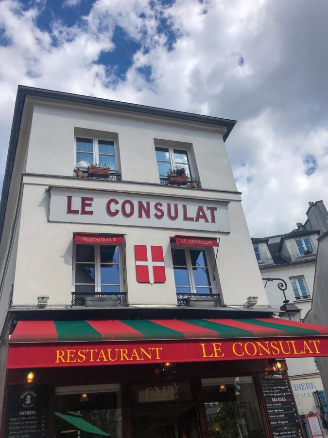 Charming Parisian dining at Le Consulat restaurant in Montmartre, Paris with iconic French architecture and cuisine