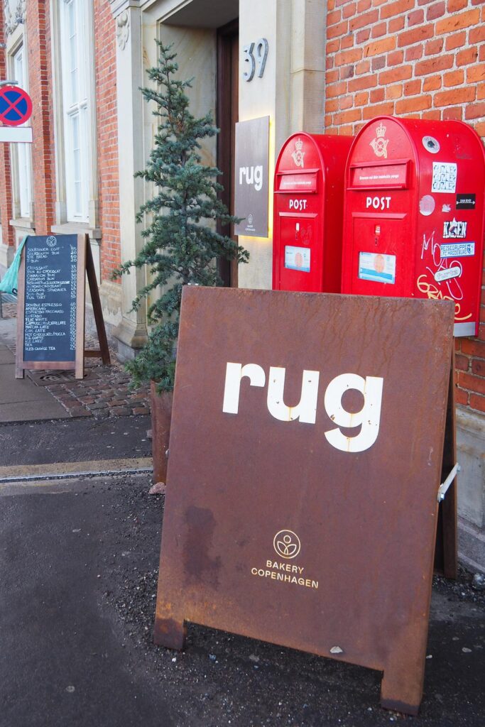 Rug Bakery entrance at Villa Copenhagen beside red post boxes