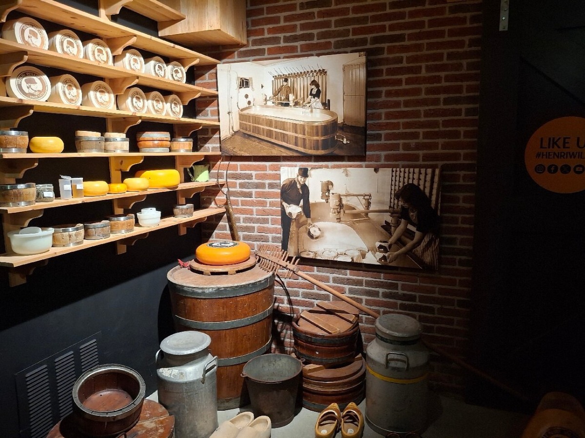 Cheese-making museum display at traditional shops in Amsterdam with vintage dairy tools.