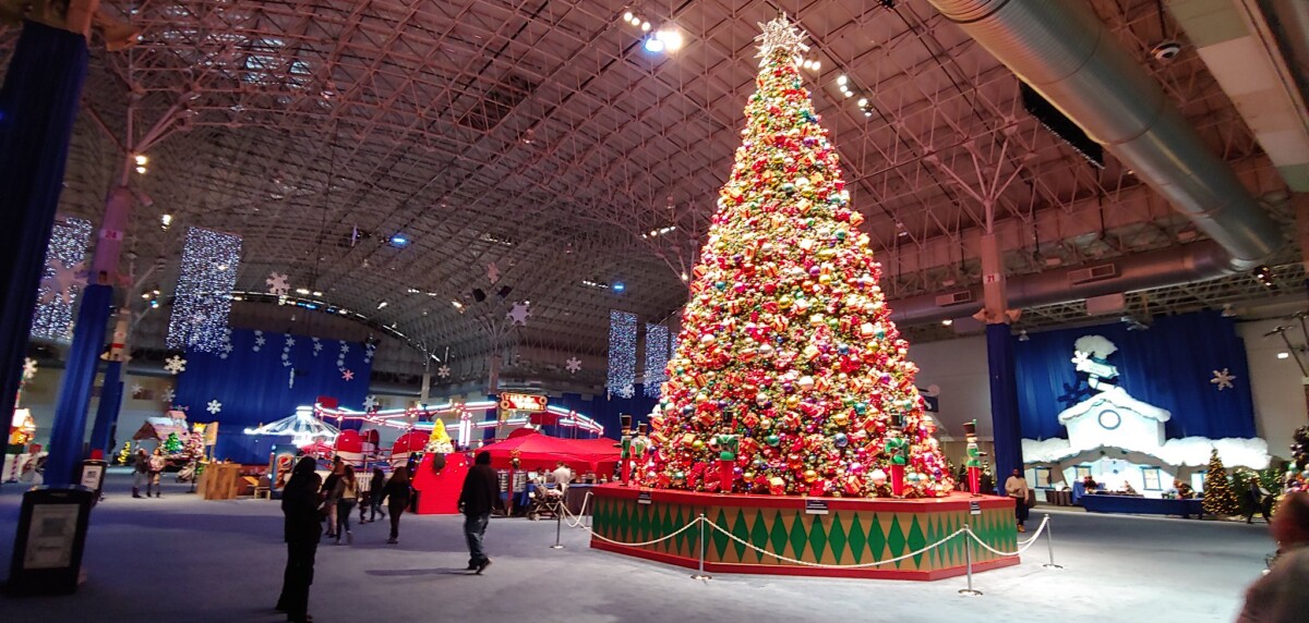 Families walking through indoor holiday displays at Navy Pier's Winter WonderFest