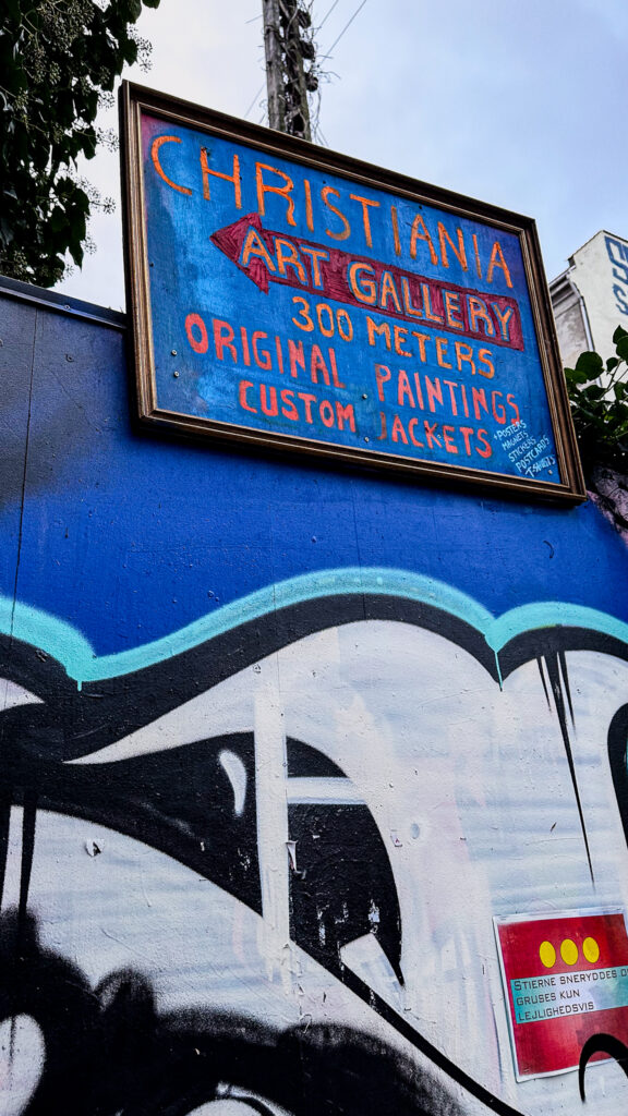 Paintings displayed outside an art gallery in Freetown Christiania