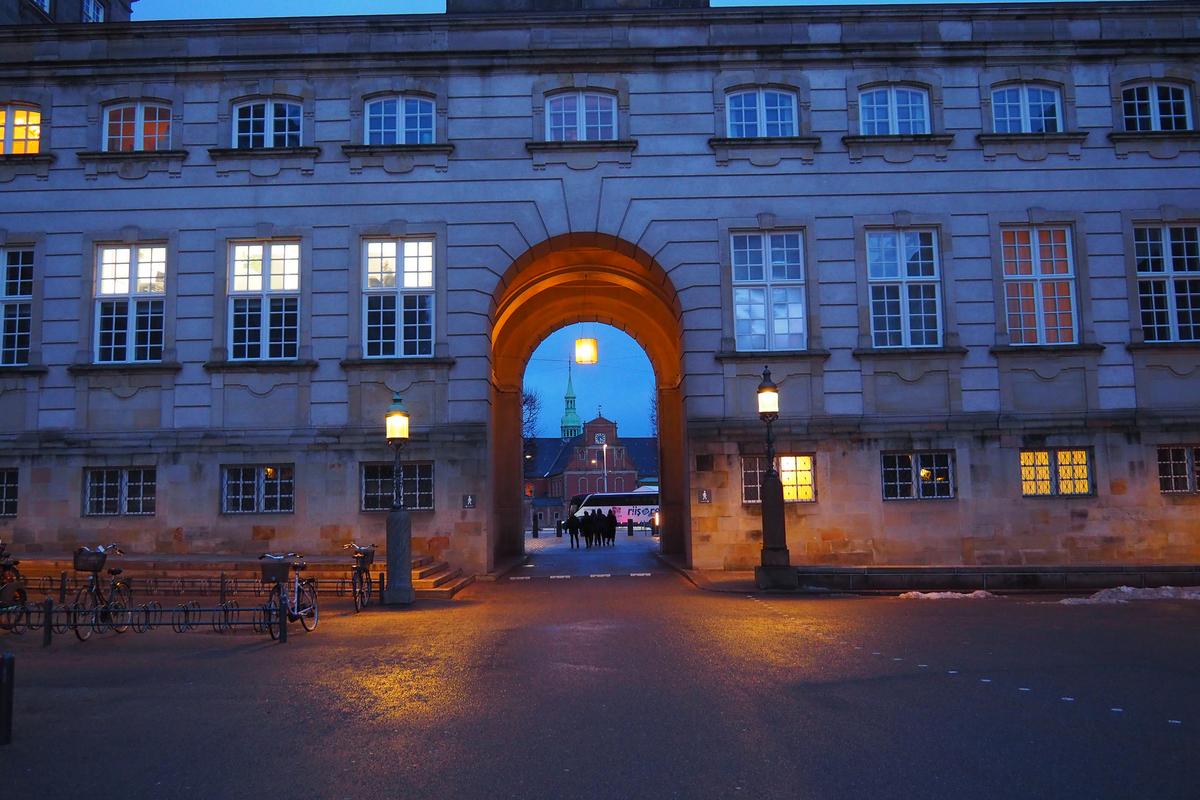 Twilight view of Christiansborg Palace with bicycles in Copenhagen