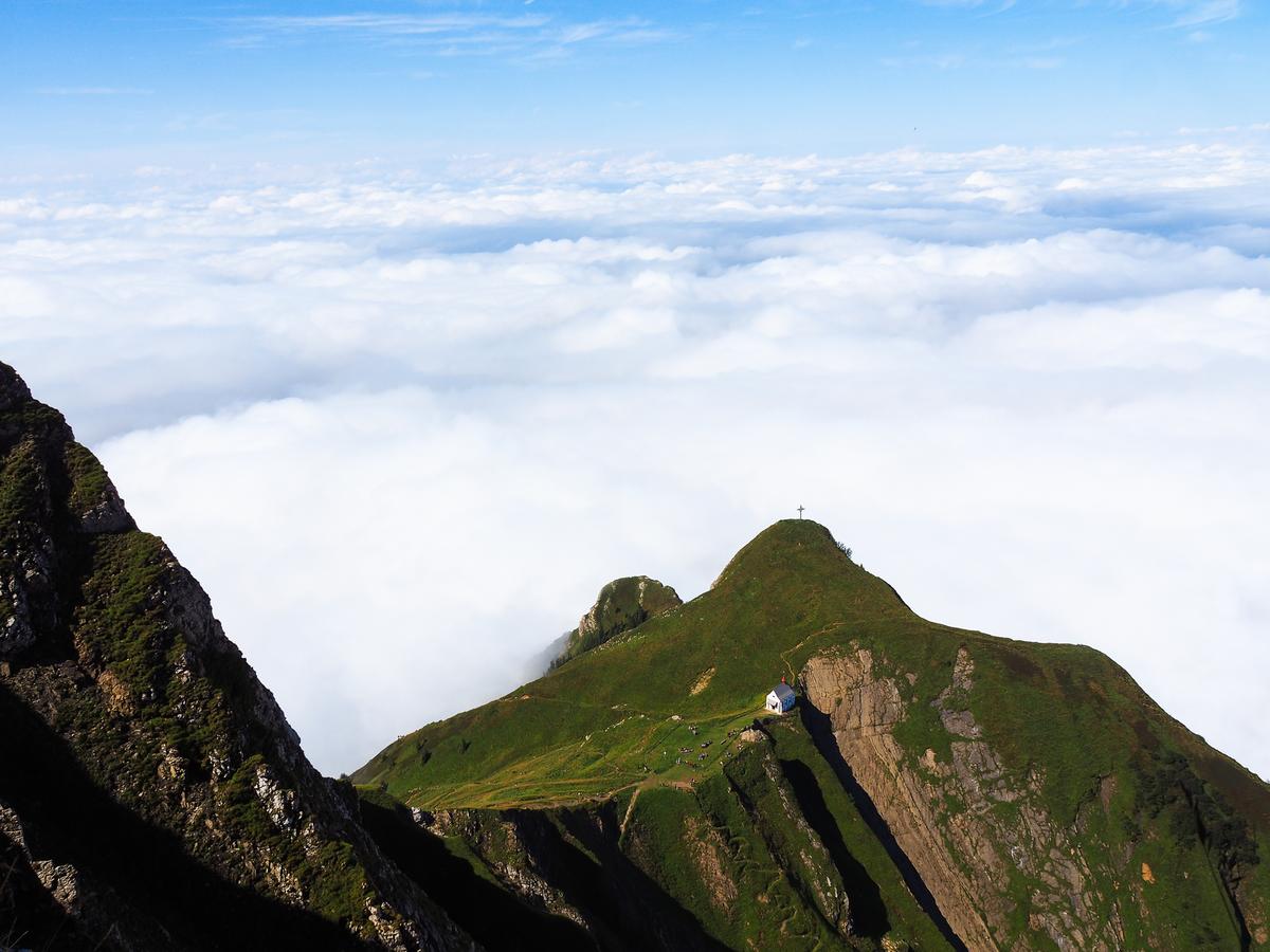 Breathtaking view of Mount Pilatus church above clouds in Switzerland's Mt. Pilatus