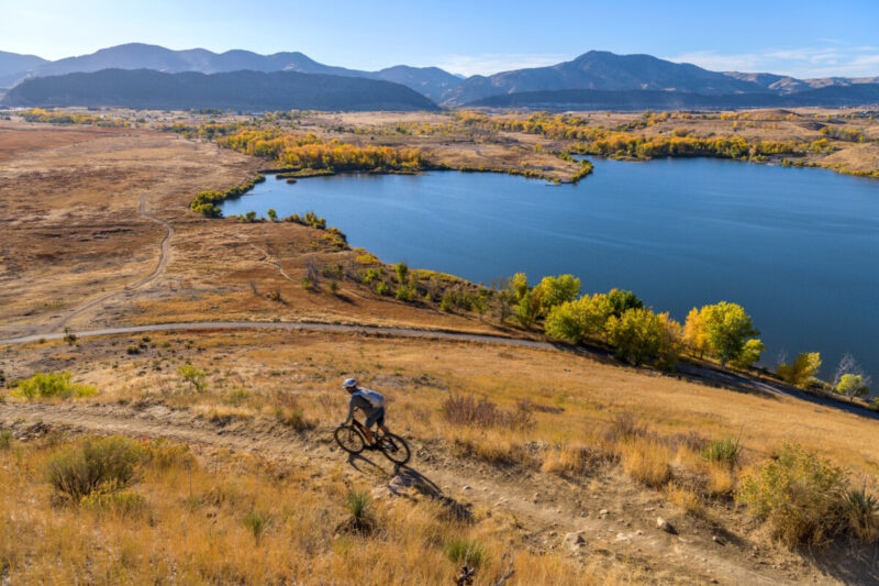 Man biking on a bike trail at Bear Creek Lake Park, Colorado