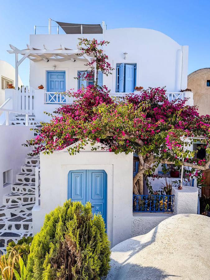 Colorful Santorini house with stunning views, Oia, Greece vibrant travel destination