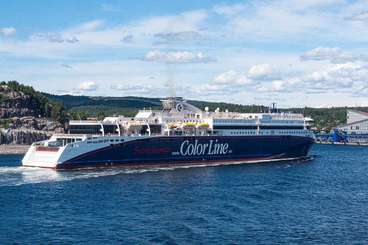 Color Line SuperSpeed ferry cruising in Kristiansand, Norway under a clear blue sky