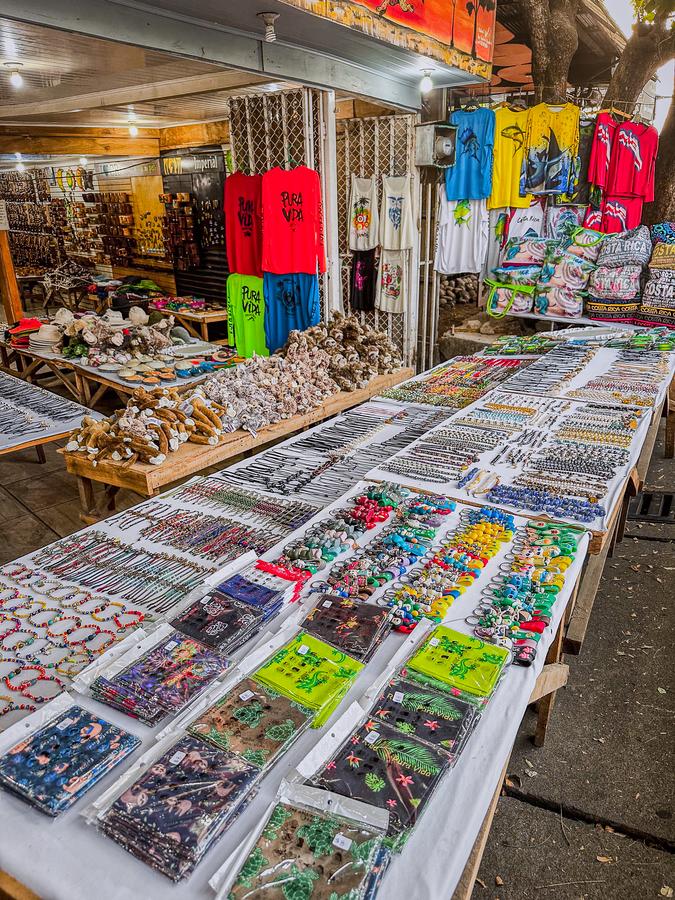 Colorful Costa Rica souvenirs: Pura Vida shirts, keychains, handmade items in local shop