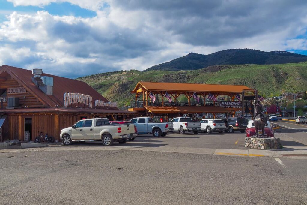 Rustic mountain retreat at Cowboy's Lodge and Grille, featuring wooden architecture and frontier ambiance.