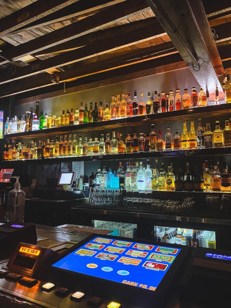 Cozy ambiance at Peppermill Resort's bar with video poker and spirits collection
