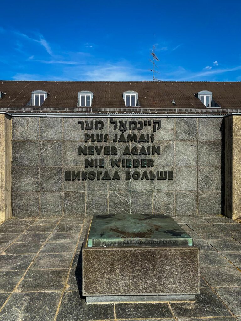 Multilingual 'Never Again' Memorial at Dachau Concentration Camp, Germany.