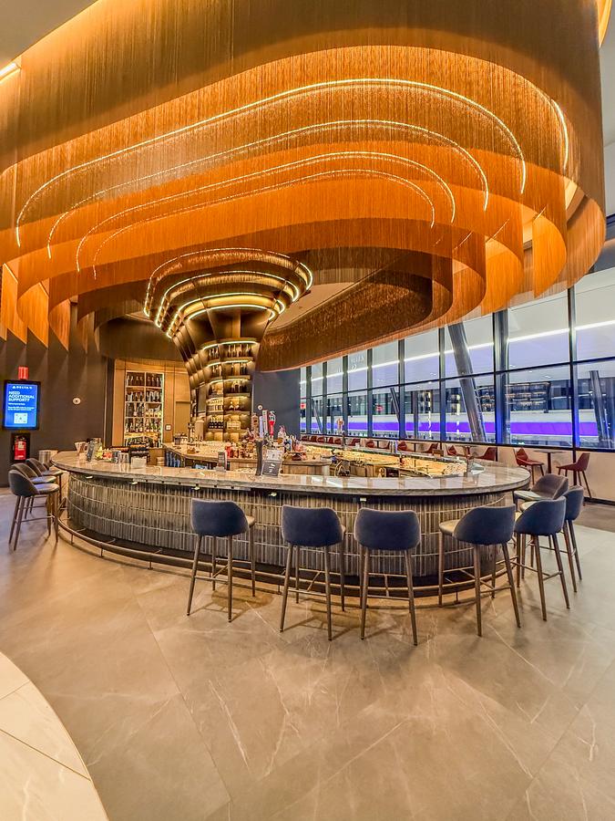 Delta Sky Club Boston bar lounge offering luxury and comfort for travelers at Boston Logan Airport