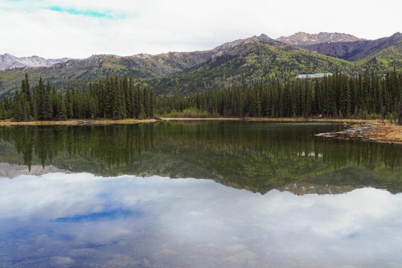 Serene Horseshoe Lake reflection in Denali National Park Alaska