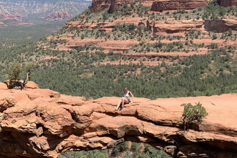 A cliffside view of red buttes and Devil's Bridge, Sedona.