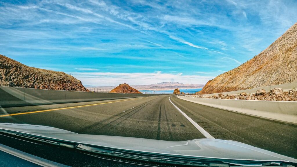 Scenic drive from Las Vegas to Lake Mead, clear skies vibrant landscapes pathway to Hoover Dam