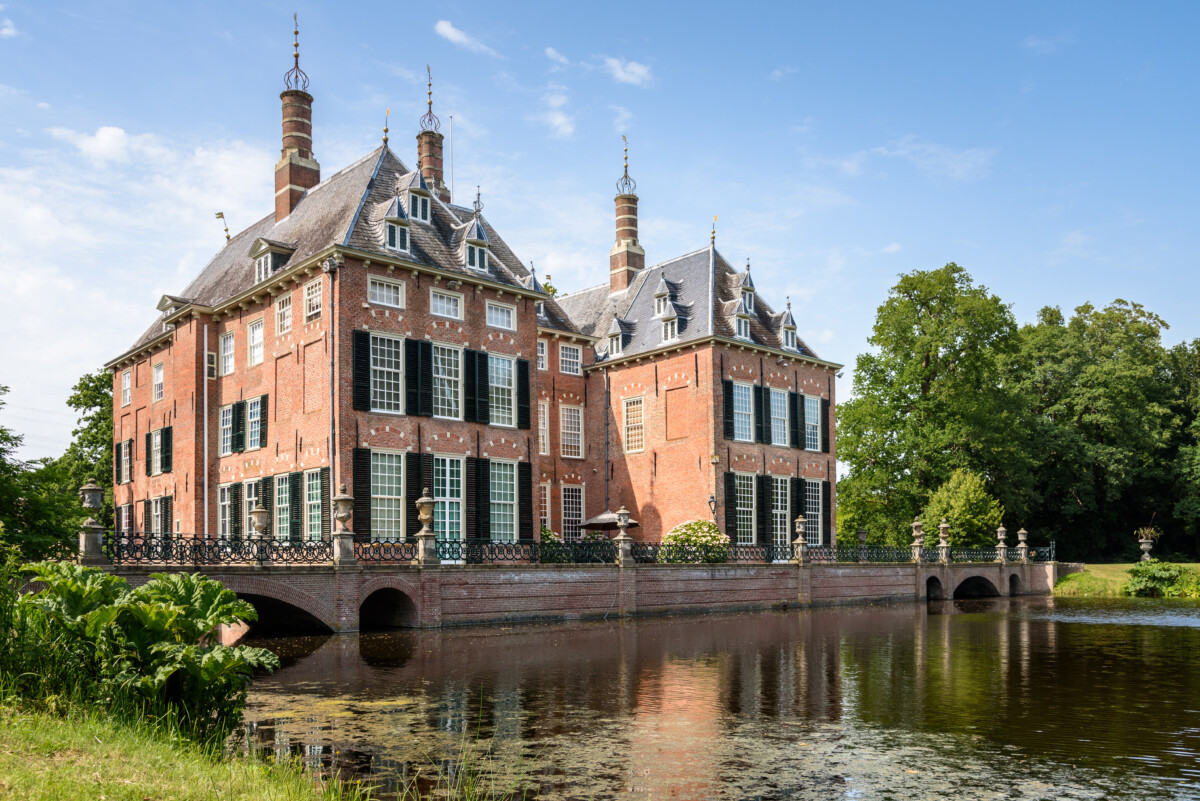Historic Duivenvoorde castle in the countryside of Netherlands on a clear summer day
