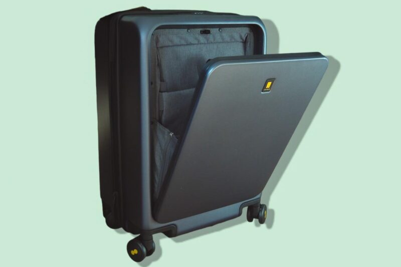 Close-up view of LEVEL8 black hardshell spinner suitcase showcasing durable build and stylish design.