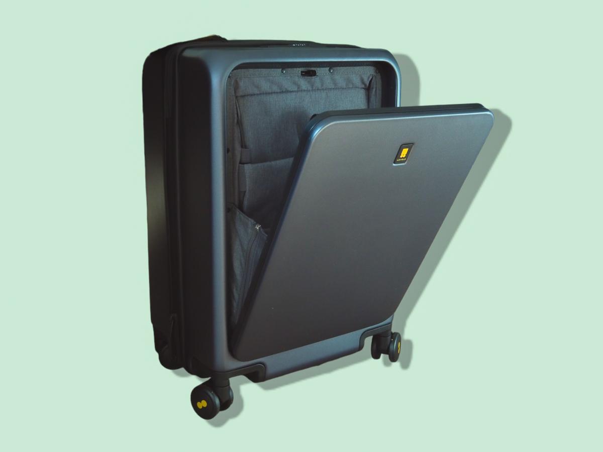 Close-up view of LEVEL8 black hardshell spinner suitcase showcasing durable build and stylish design.