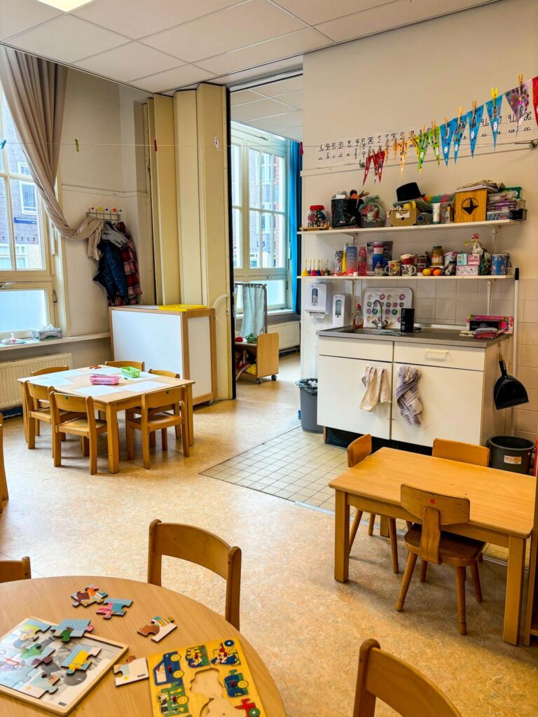 Sunny Dutch classroom full of educational materials and colorful decor