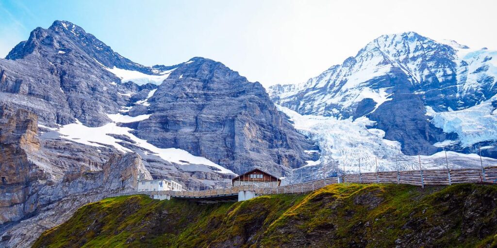 Eiger Glacier and quaint hut in Swiss Alps landscape