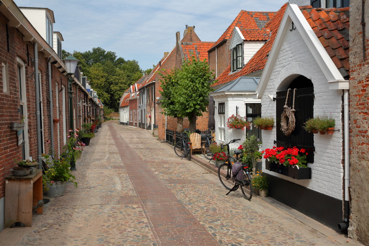 Narrow pathway and historic medieval houses of Elburg in the Netherlands