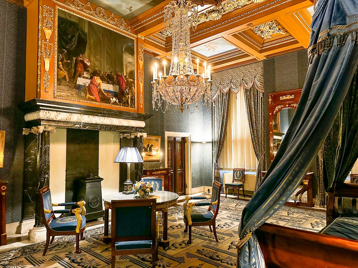 Royal Palace Amsterdam interior design with golden trimmings, majestic chandelier, and cultural heritage