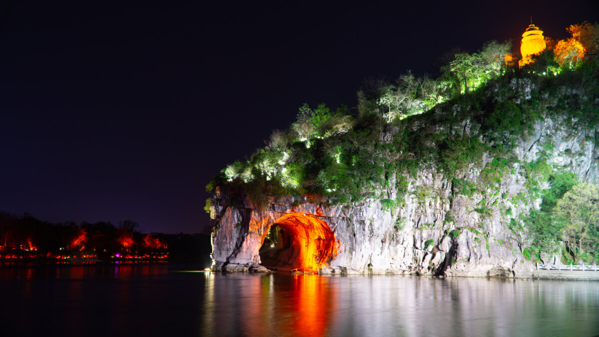 Elephant Trunk Hill and the Li River illuminated at night in Guilin