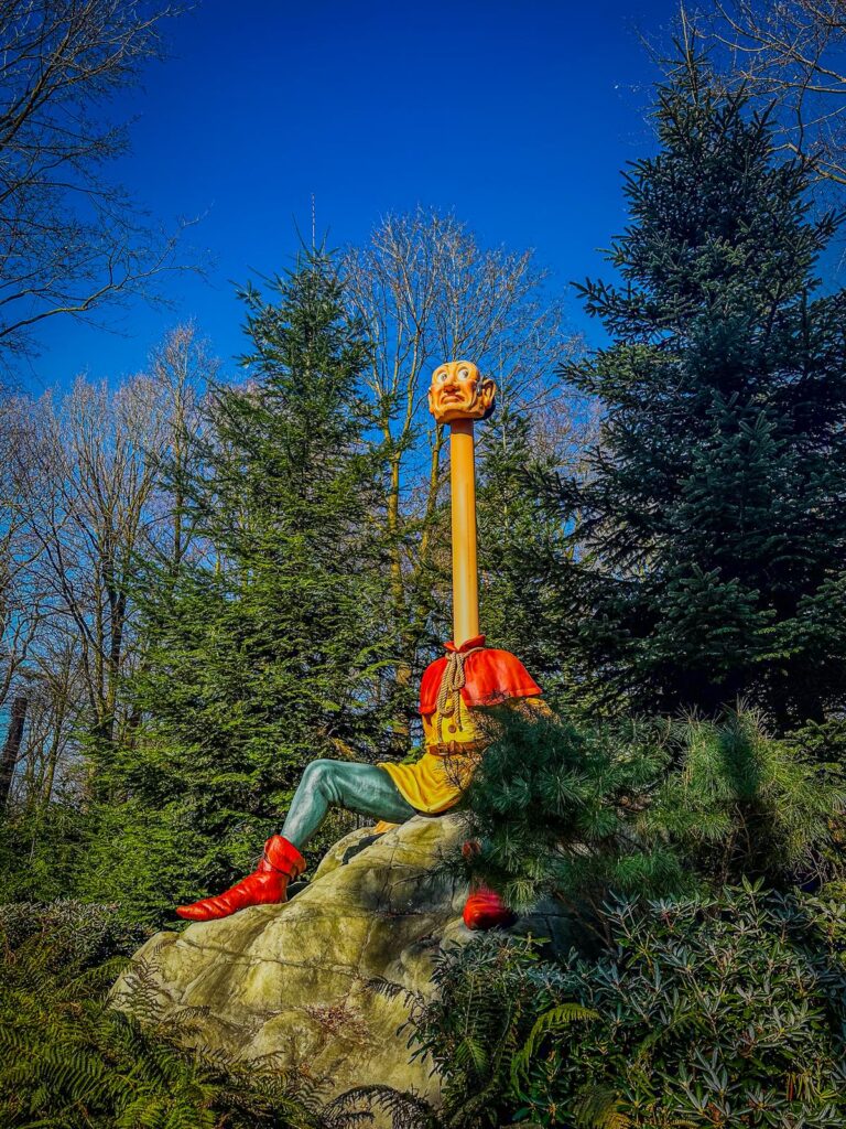 Giant storybook character with telescope in Fairy Tale Forest at Efteling Theme Park
