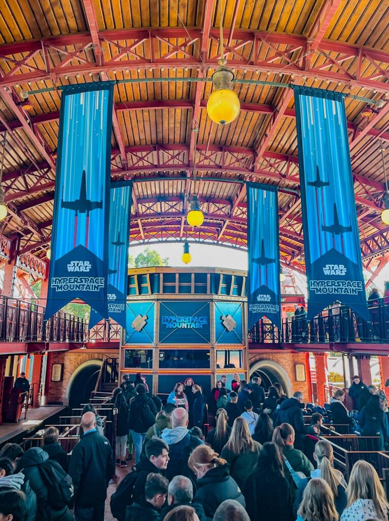 Enthusiastic visitors await Star Wars Hyperspace Mountain at Disneyland Paris.