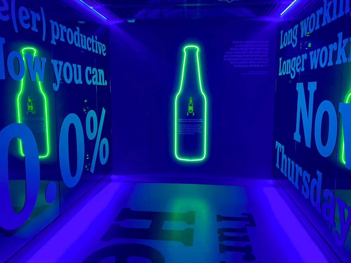 Neon-lit Heineken Experience in Amsterdam, showcasing brewery tour and interactive exhibit