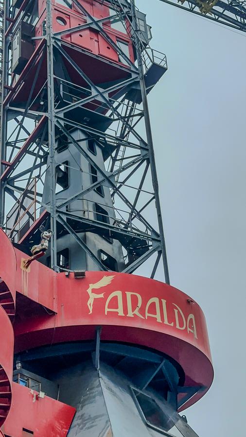 Close-up of the iconic red Crane Hotel Faralda in Amsterdam.