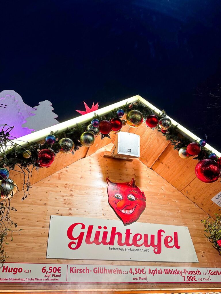 A wooden Glühwein stand festooned with Christmas decorations at the Düsseldorf Christmas Market.