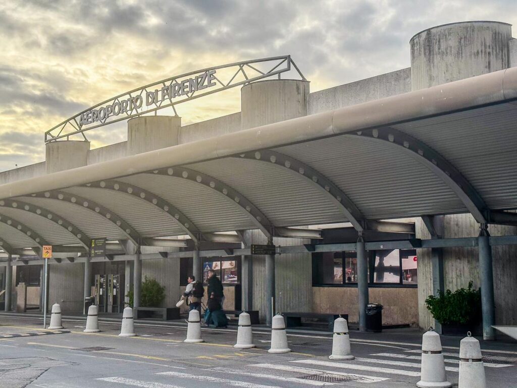 Florence Airport (Aeroporto di Firenze) entrance with modern architecture and taxi stand in Tuscany, Italy.
