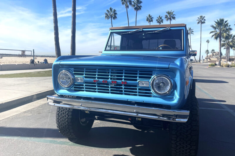 Ford vehicle driving on beach