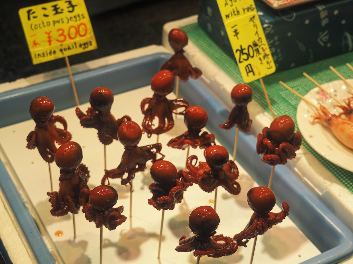 Fresh octopus skewers for sale at Nishiki Market, Kyoto, Japan seafood street food market