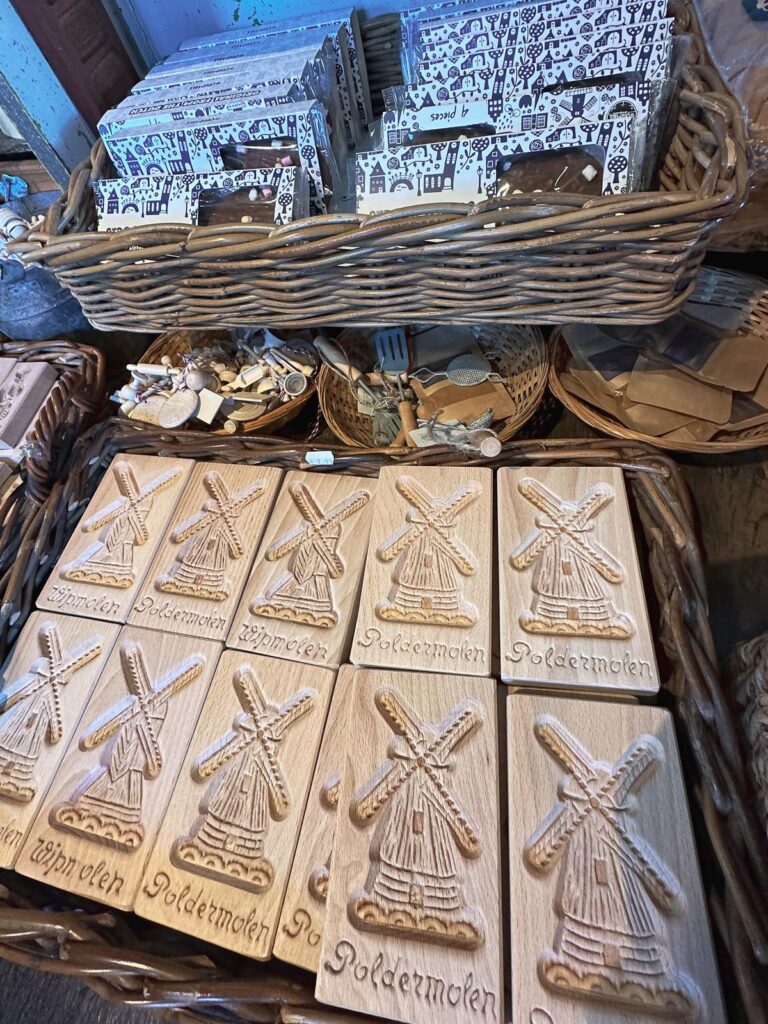 Close-up of hand-carved wooden windmill souvenirs at Zaanse Schans Bakery Museum.