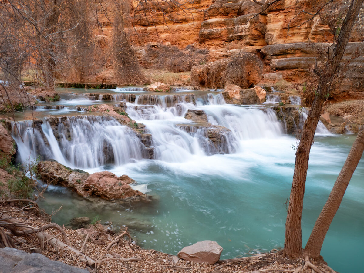 Beaver Falls on Havasu Creek, Havasupai Reservation: turquoise pools, white cascades amid orange canyon walls.