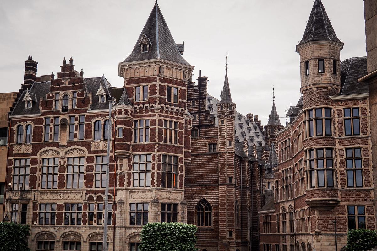 Historic brick buildings along a central Antwerp street