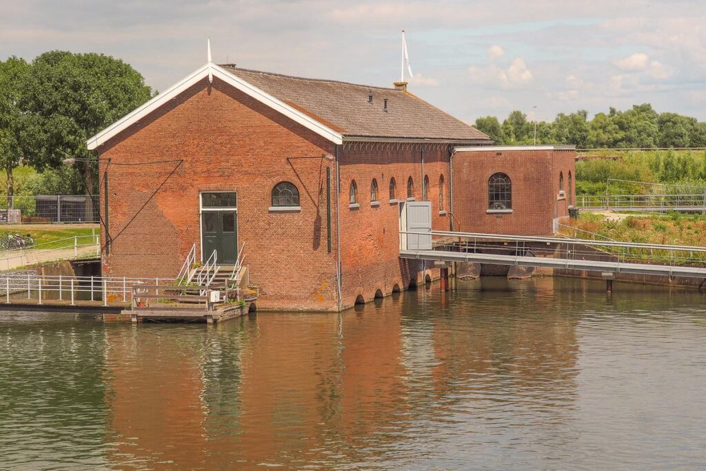 Historic Pumping Station at Kinderdijk, Netherlands - Dutch water management engineering marvel by the waterfront.